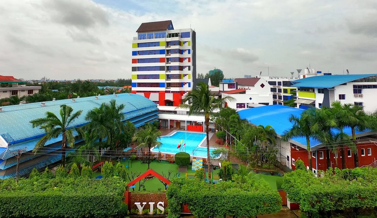 An aerial view of the school buildings and central swimming pool.