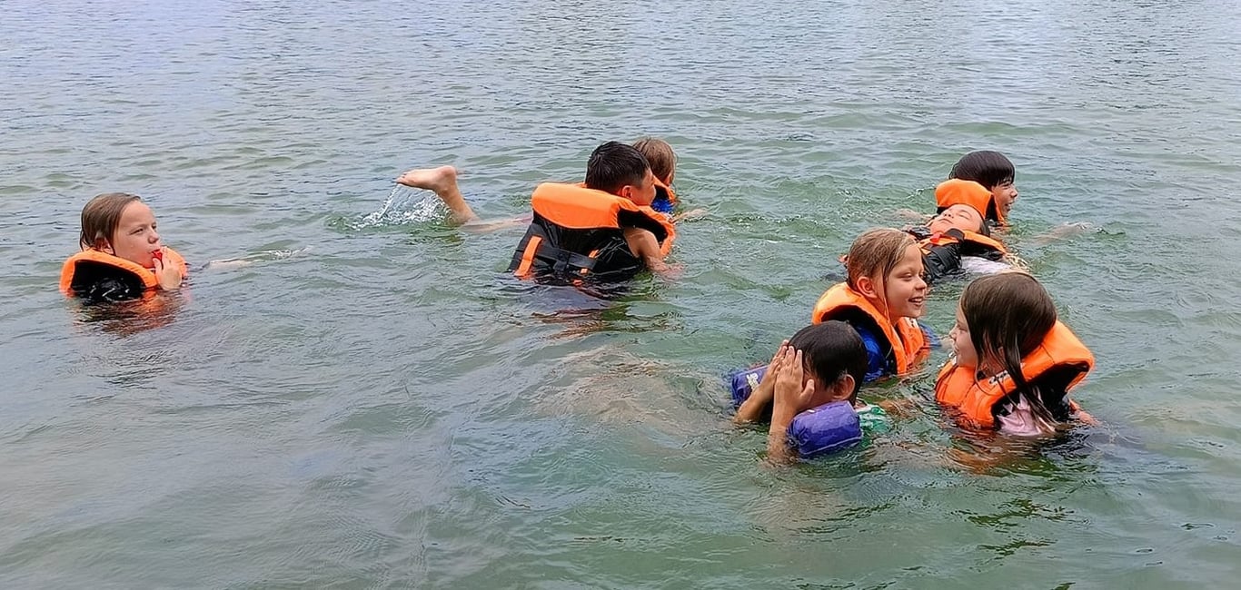 Students taking part in water activities at Eden Garden.