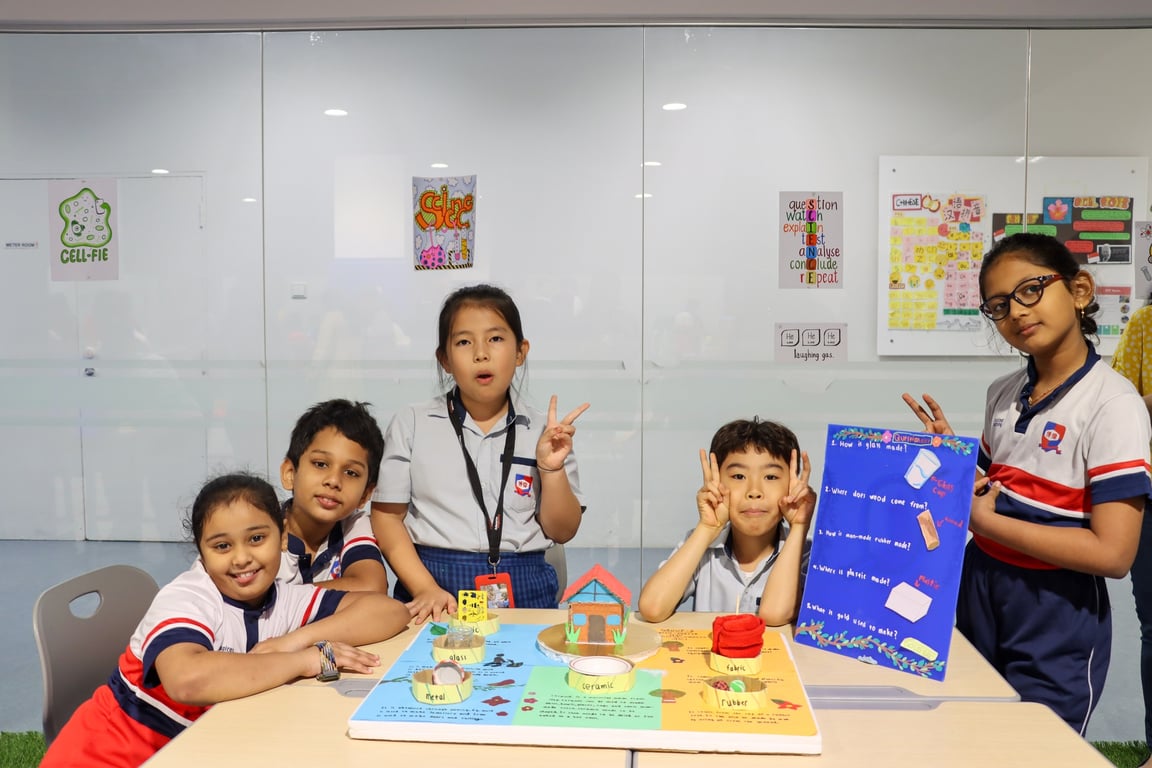 Primary students displaying their project for the Primary Science Exhibition at School