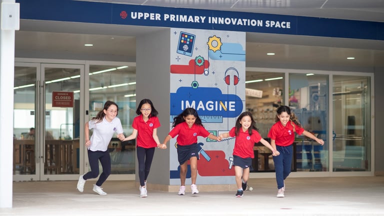 Upper primary students running out of the Innovation Space, full of energy and excitement.
