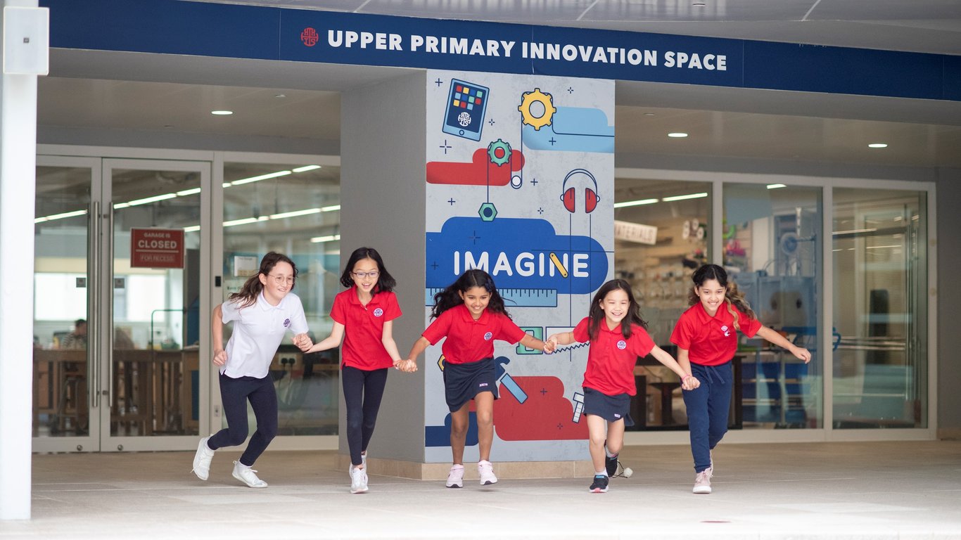 Upper primary students running out of the Innovation Space, full of energy and excitement.