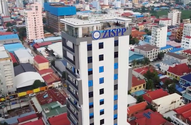 Zion International School of Phnom Penh main campus building towering over the neighbourhood.