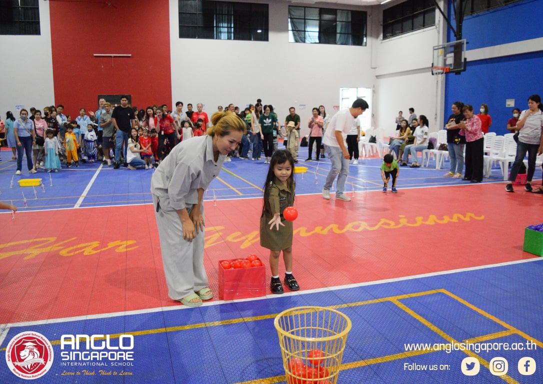 The school community participating in activities at last day of school party.