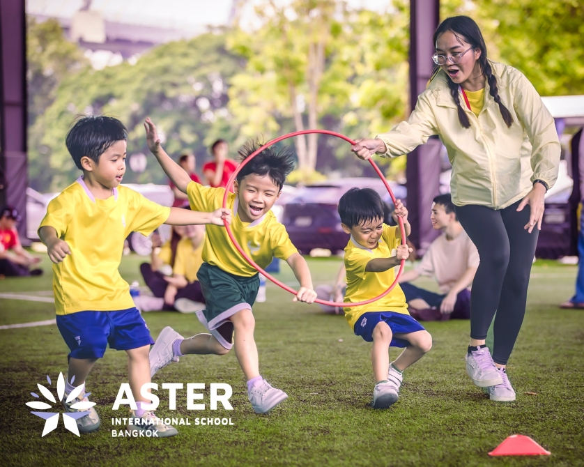 Young learners enjoy outdoor activities with their teacher.
