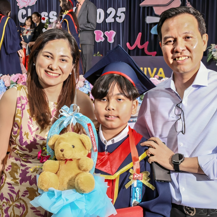 Graduate celebrates achievement with family on commencement day.