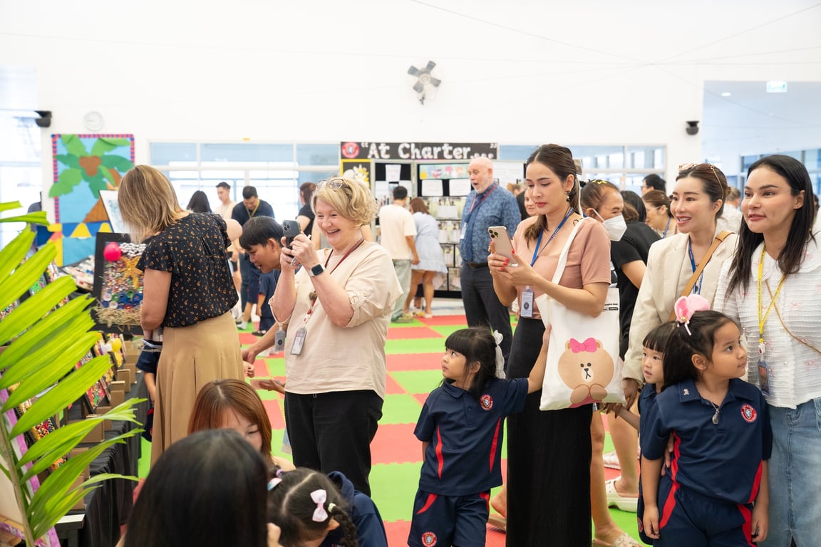 Parents watching Early Years students showcase creativity at the Art Show.