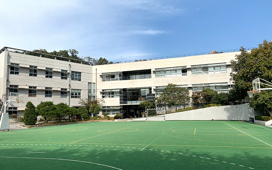 School courtyard and sports facilities at Lycée International Xavier.