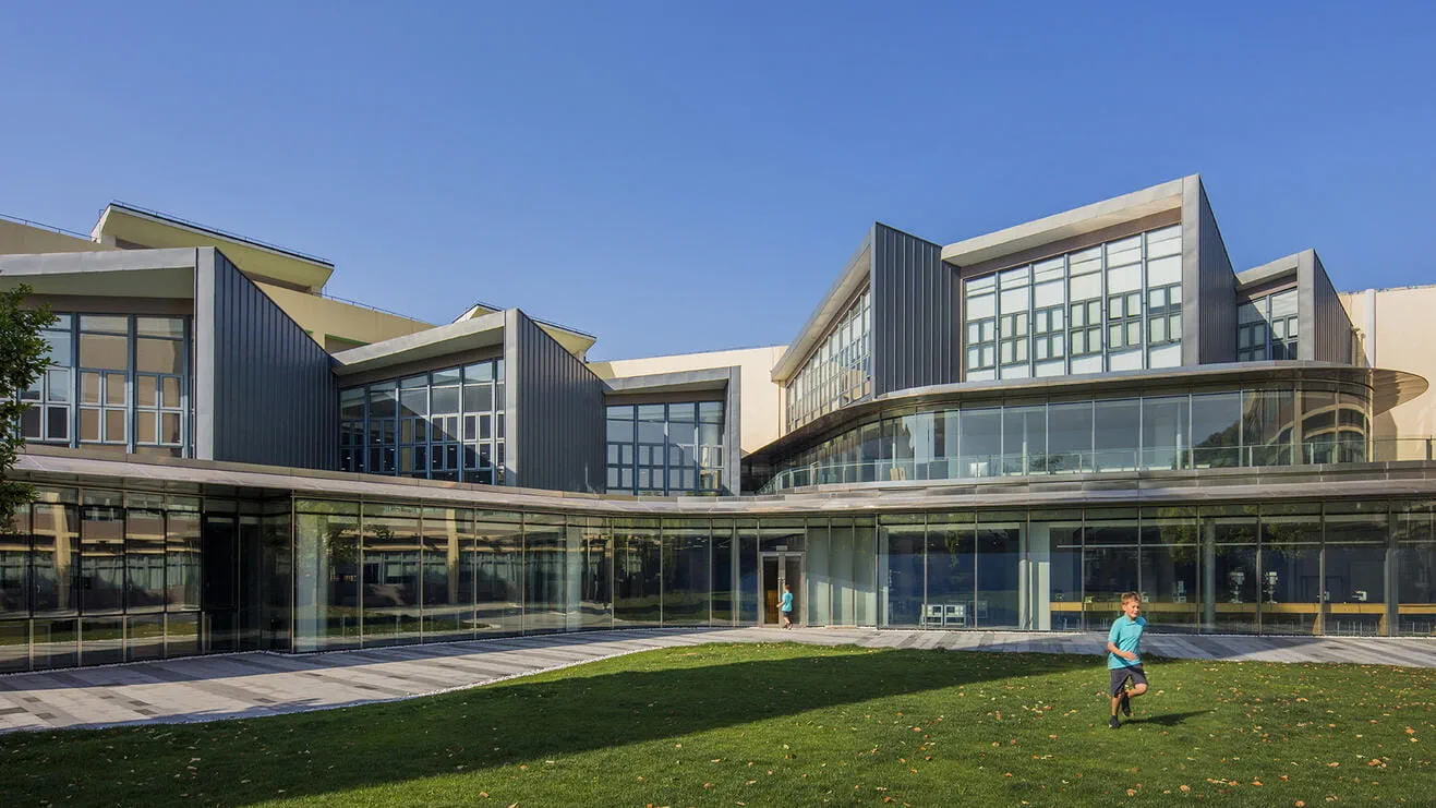 Expansive glass facades overlooking the central courtyard at the Puxi campus.