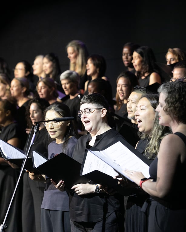 Parents, teachers, and students performing together at the Choral Bash Concert at NIST Bangkok.