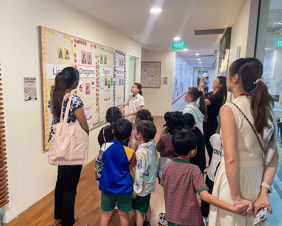 Primary School Students from Orchard present their work to parents and students from the Newton Preschool, part of the EtonHouse family.