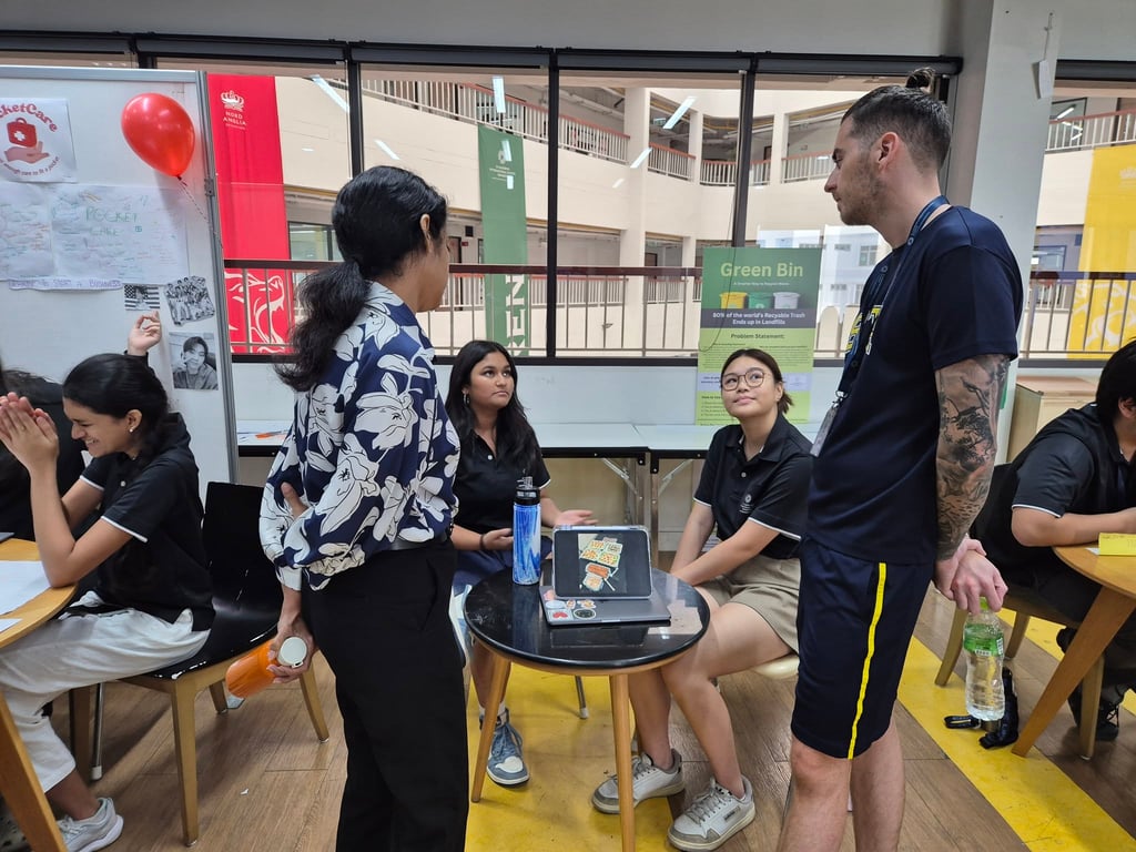 Year 12 students presenting projects during a mini-exhibition.