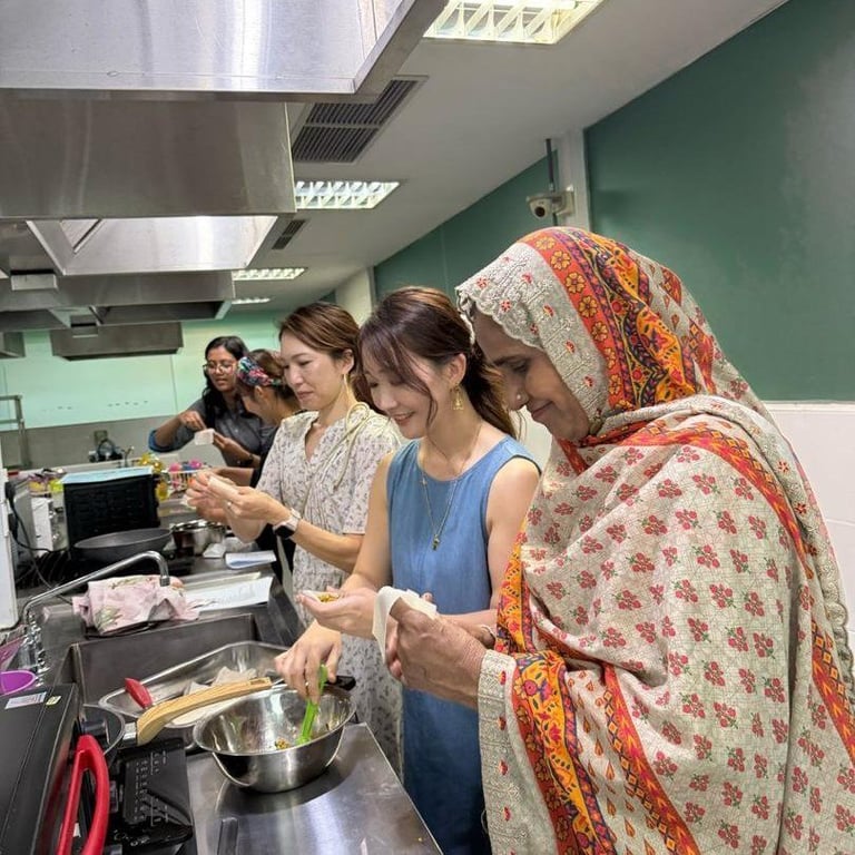 Parents helping to set ahead of the Hari Raya festival event on campus
