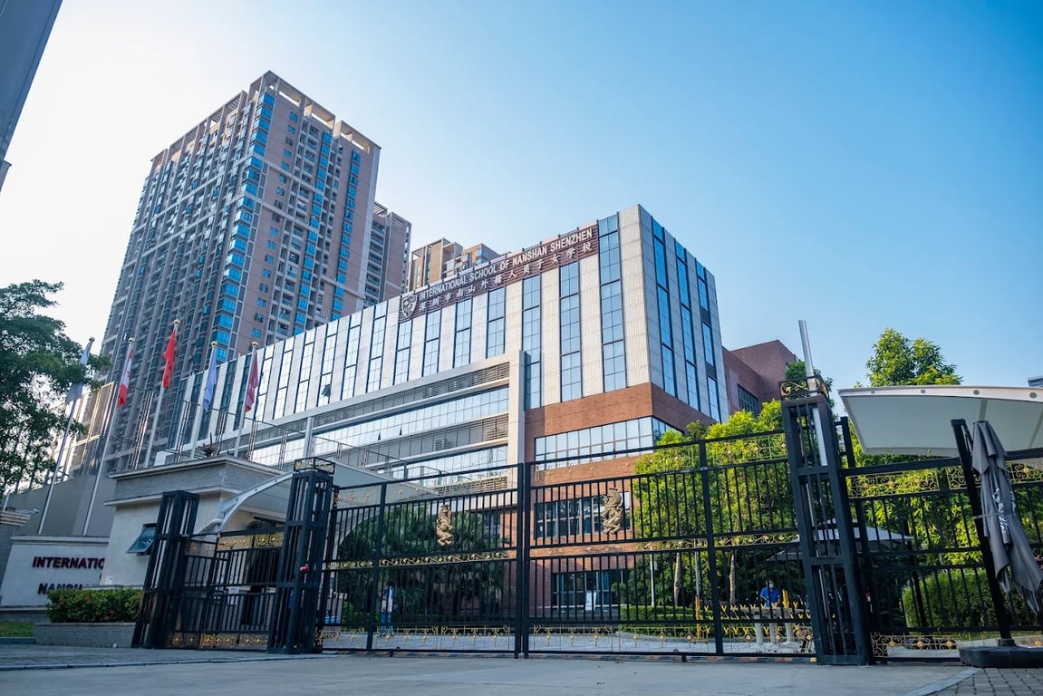 The modern glass and brick academic buildings at ISNS in Shenzhen.