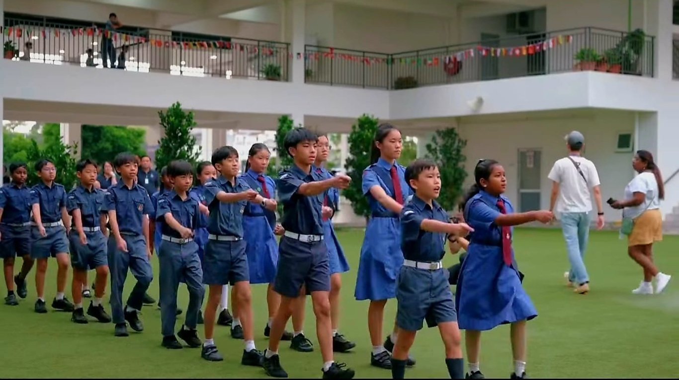 Students marching in formation during a school activity