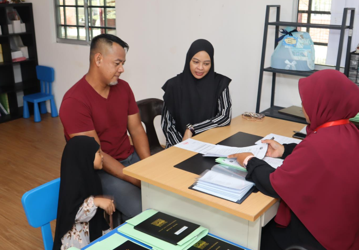 A family discussing about their child's report card.