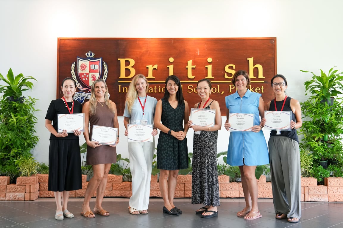 BISP parents receiving certificates after completing a Thai language course.