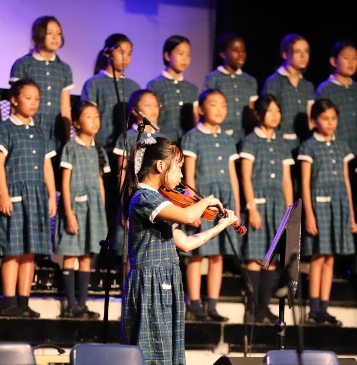 Celebrating the performing arts — from choral ensembles to soloists, students gain confidence and joy through creative expression on stage.