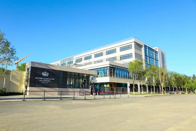 The main entrance and contemporary academic buildings at the NAS Beijing Shunyi campus.