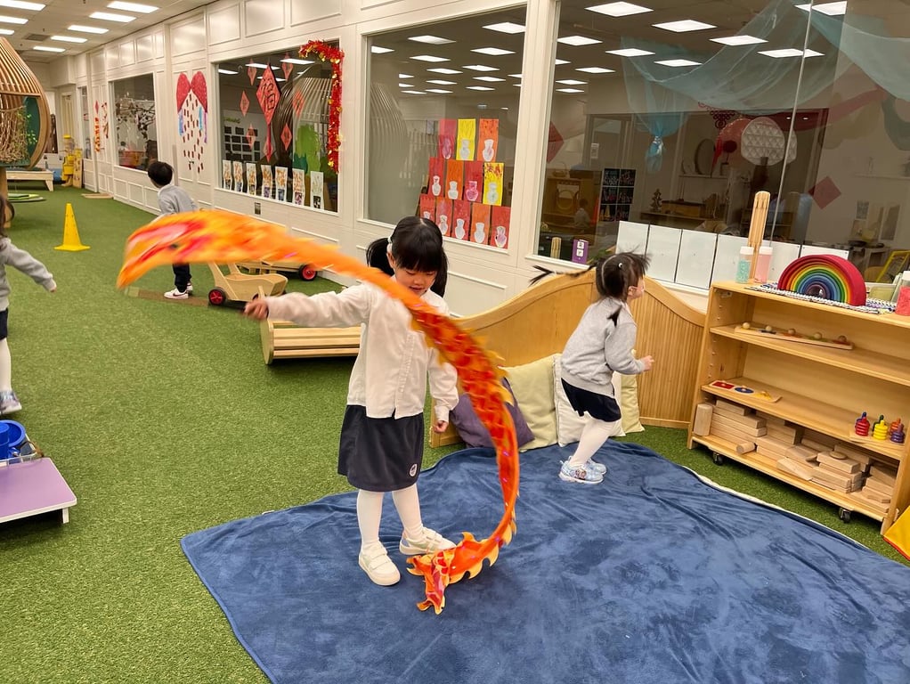 Children celebrating Chinese New Year with a playful dragon activity.