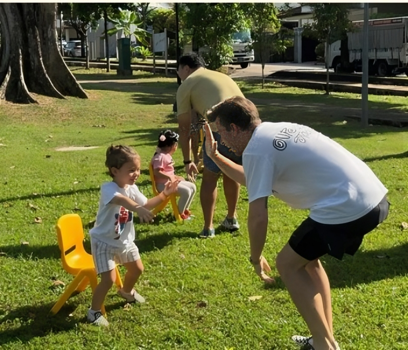 Child sharing a playful moment with dad on Father’s Day.