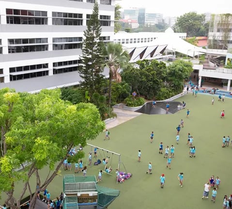 An elevated view of students playing in the recreational area on campus