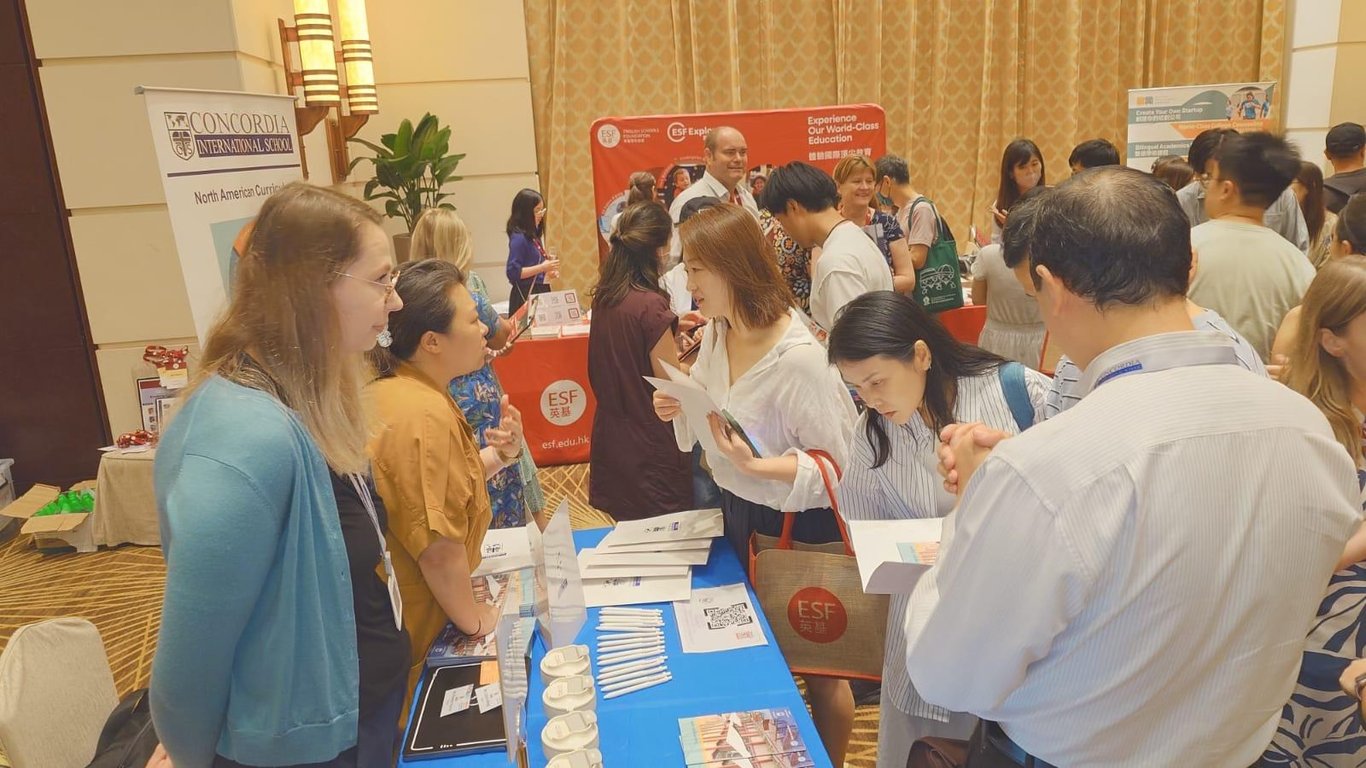 Parents engaging with Concordia staff at the International School Fair.