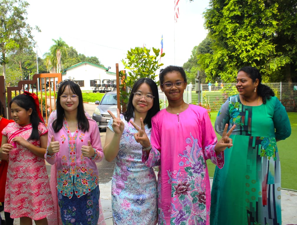 Students wear traditional Malaysian attire as part of a cultural dress day.