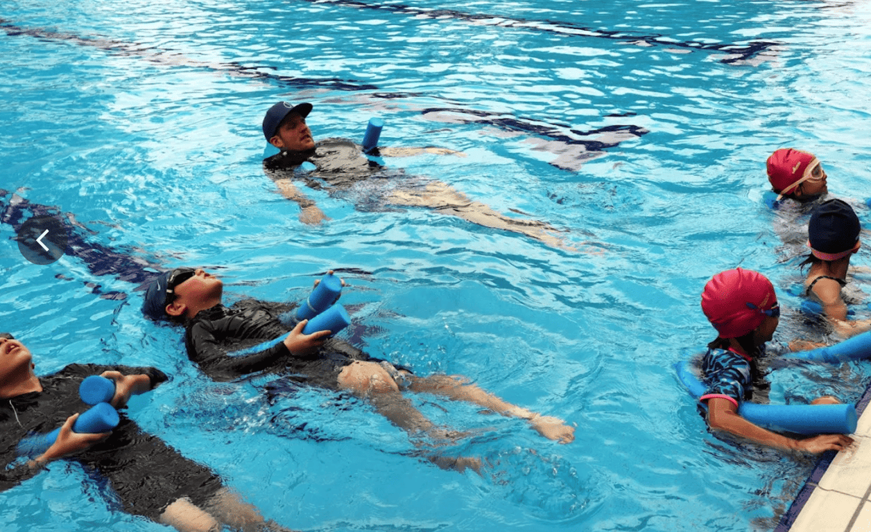 Swimming lesson being held on campus.