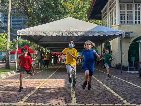 Students competing in a race during the annual Sports Day event, a day of games and activities for children, parents and staff.