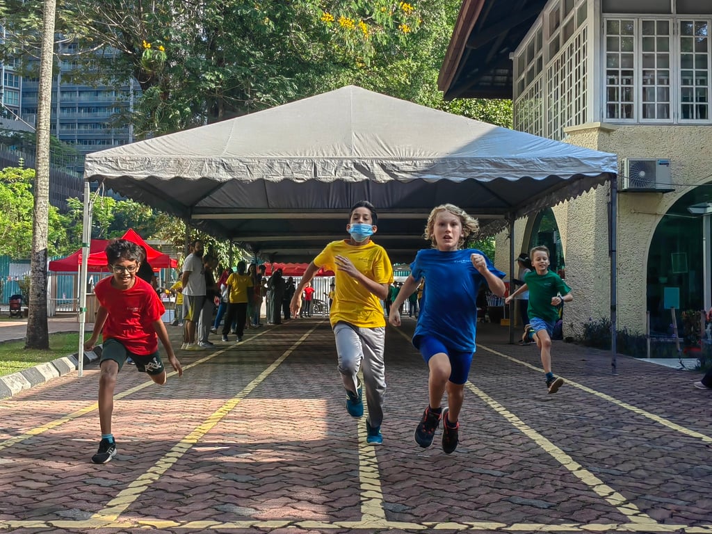 Students competing in a race during the annual Sports Day event, a day of games and activities for children, parents and staff.