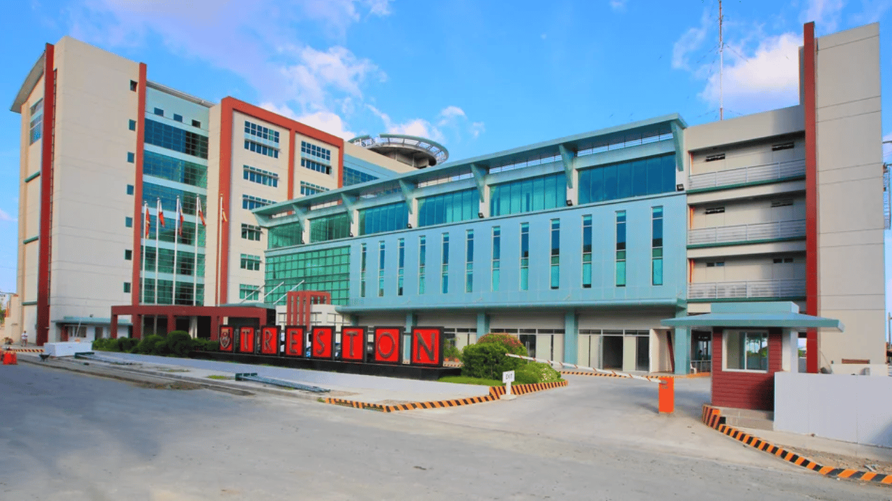 The modern multi-story academic building and main entrance of the campus.