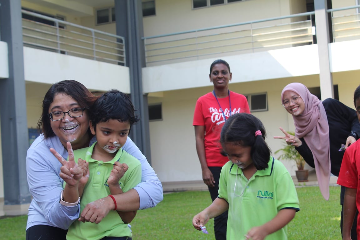 Students, parents and teachers take part in a day of fun games at the NIS Sports Day event.