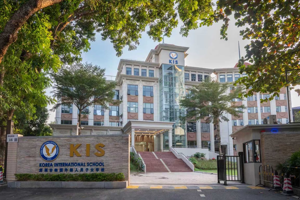 A view of the main entrance gate leading to the main campus building.