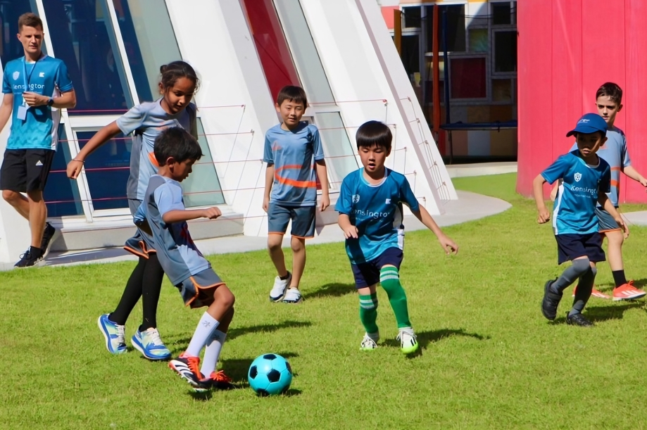 Children enjoy active play through football.