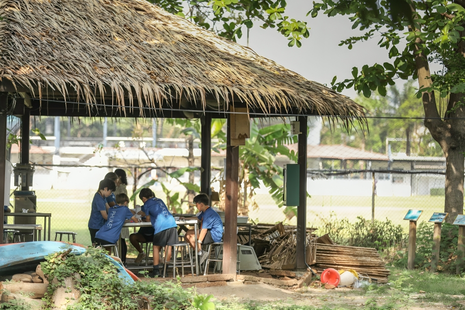 Learning outdoors under the shade.