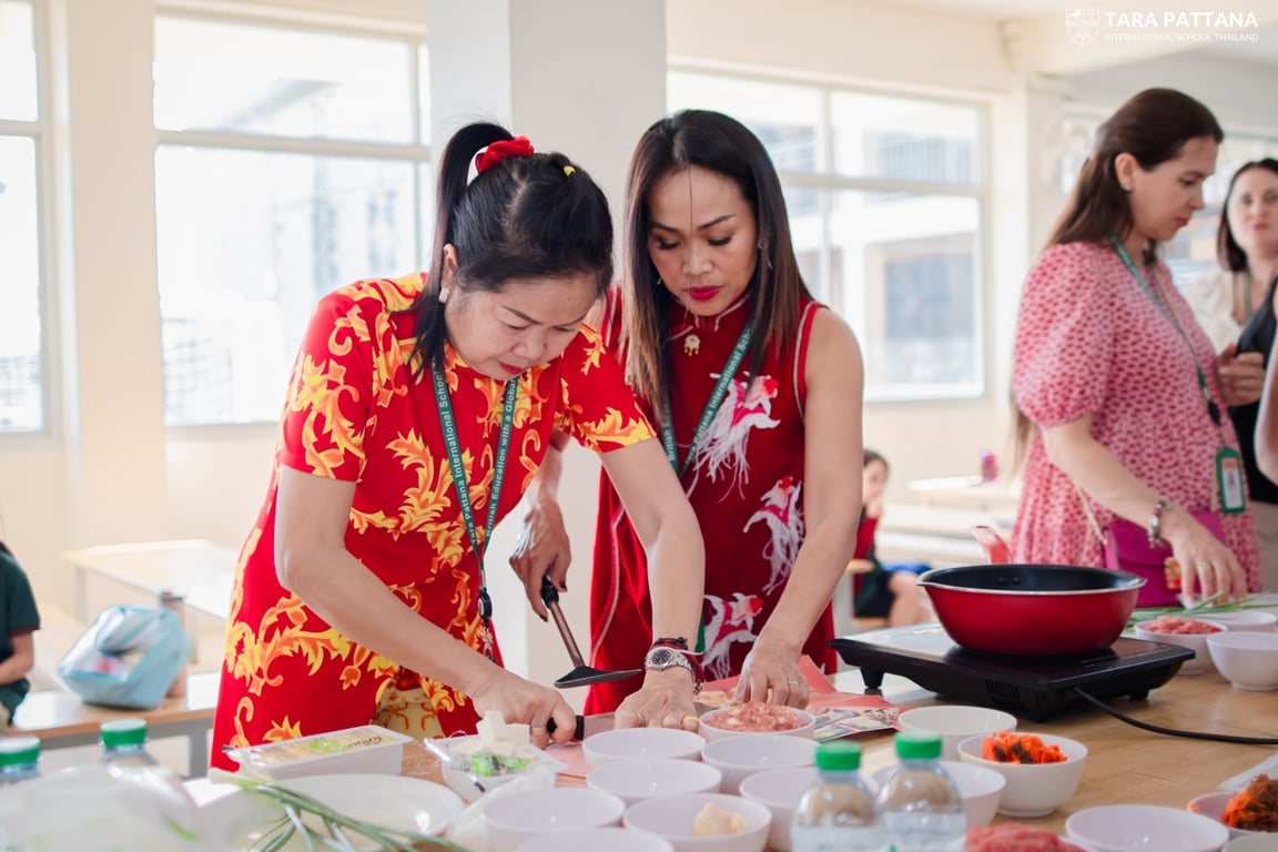 Parents preparing traditional Chinese dishes at the FoTA workshop.