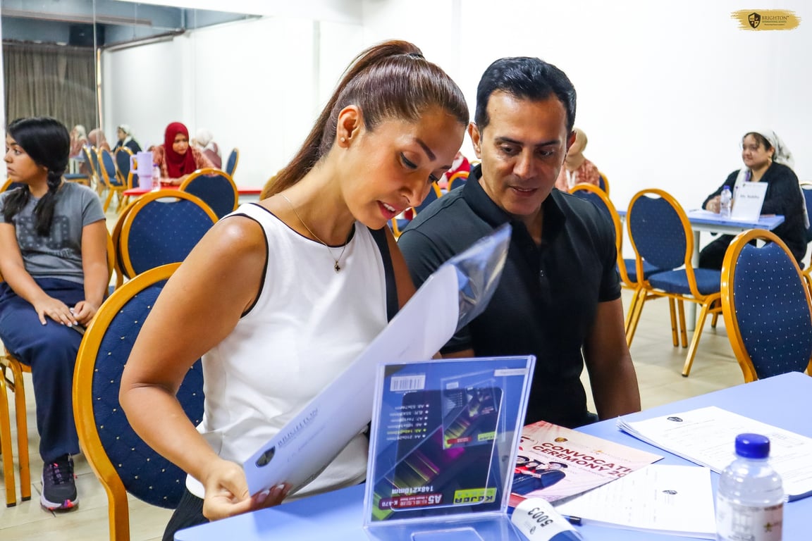 Parents checking students' progress in one of the productive conferences.