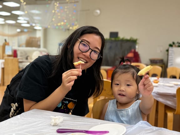 Parent and child enjoying a shared activity during the open day.