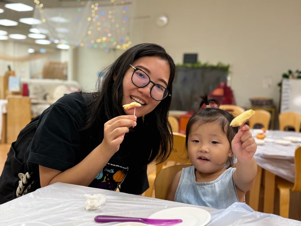 Parent and child enjoying a shared activity during the open day.