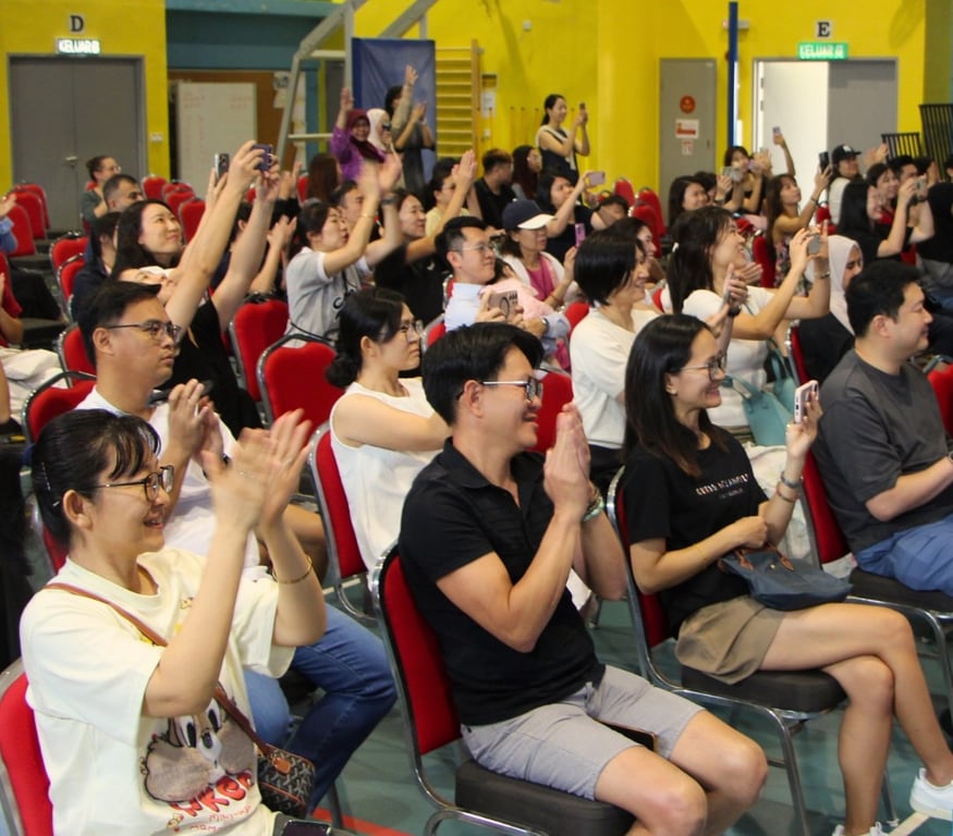 Parents cheering for performances on the Chinese New Year celebration.