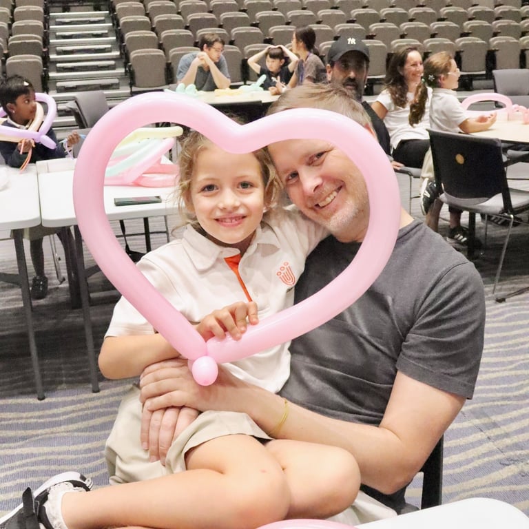 Grade 1 students and parents enjoy The Magic Toymaker Balloon Sculpture Workshop as part of the IPC unit.