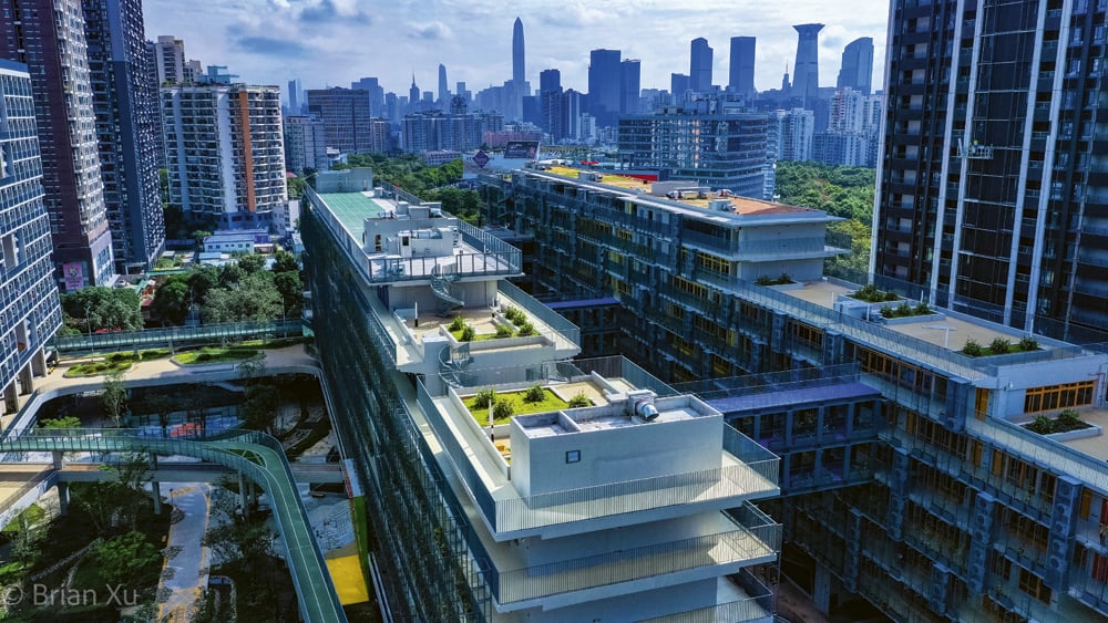 An aerial view of the modern rooftop gardens and campus at SCIE.