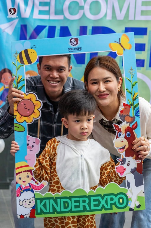 A family posing at the KinderExpo event.