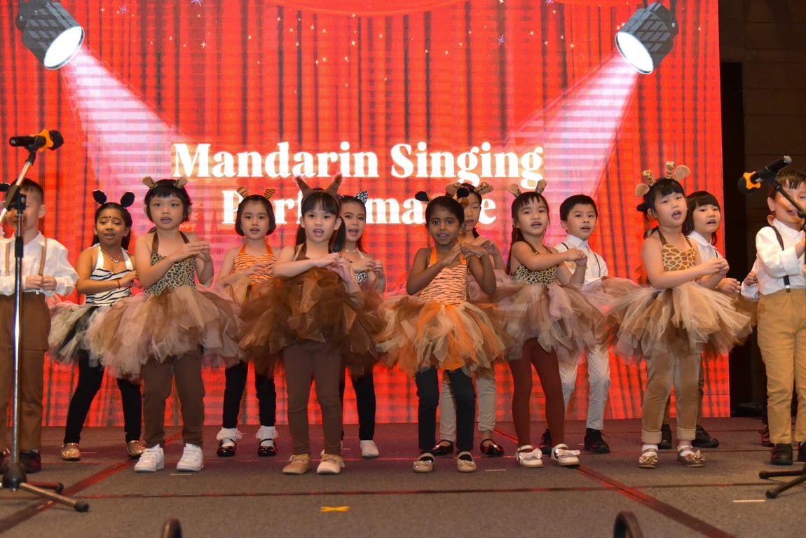 Students performing on stage during annual concert.