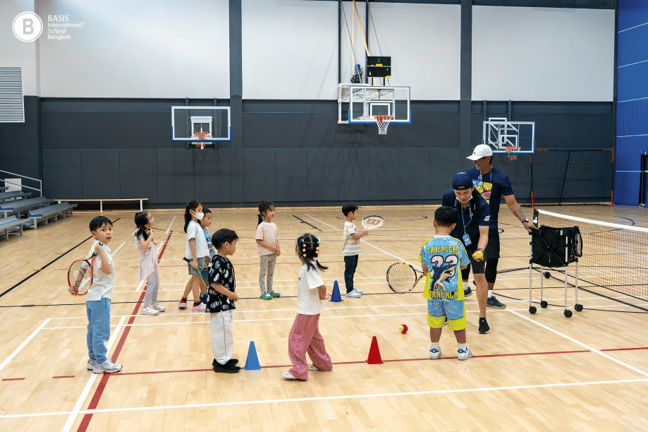 Young learners discover movement and coordination through engaging indoor sports activities.