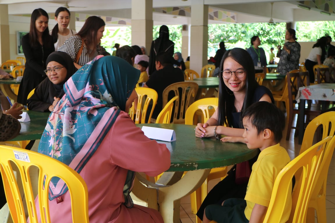 Teachers meet with parents and students during the school’s “Tea Time with Teachers” session for informal progress updates and Q&A.