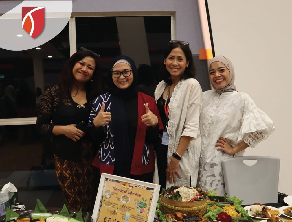 Parents in front of the Indonesian food stall during the 'Flavours of the World' event, an event where parents showcase the cuisines of their cultures.