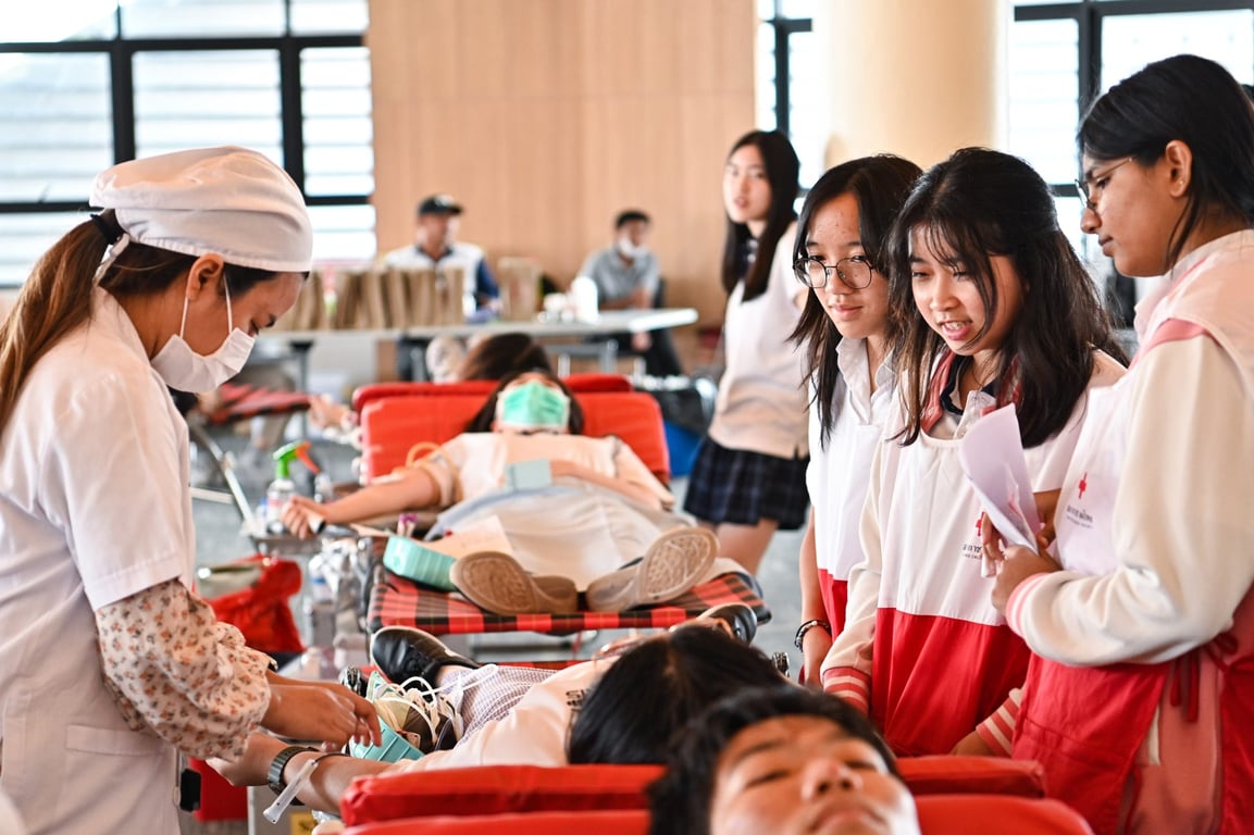 Donors and volunteers participate in a campus blood drive.