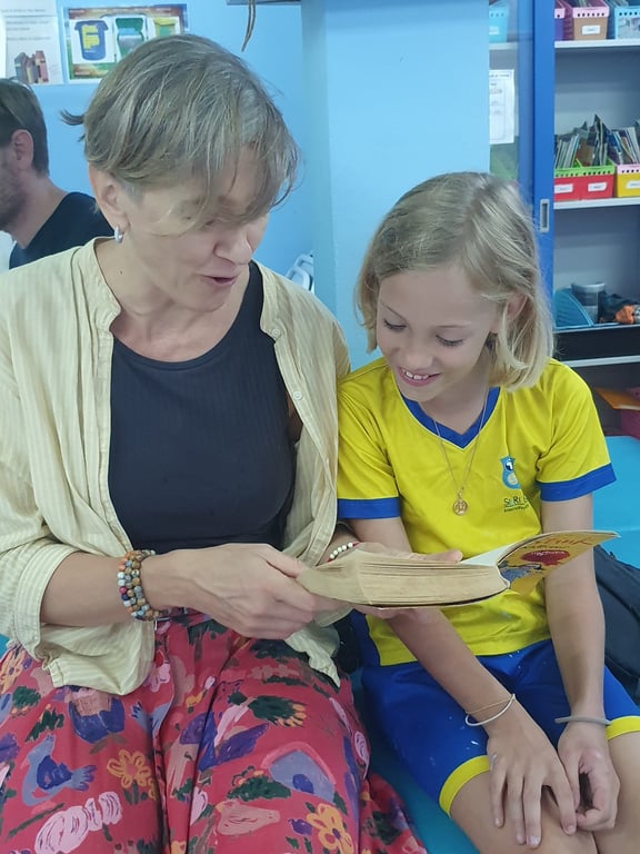 A parent and child reading together on world book day.