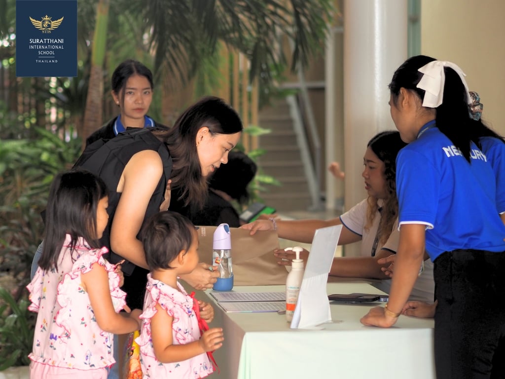 Parents register for the new school year workshop.